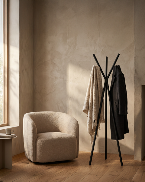 modern multipurpose cloths rack with coats and a shawl in a stylish living room setting.