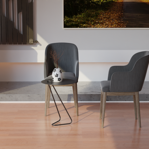 Angolo modern side table beside a minimalist chair and vase in a contemporary living space.