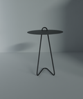 Angolo modern side table featuring a minimalist design with a round top and stylish legs, ideal for contemporary spaces.