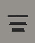 Set of three modern floating wall shelves for bathroom storage and décor ثلاث رفوف حائط عائمة حديثة لتخزين الحمام والديكور